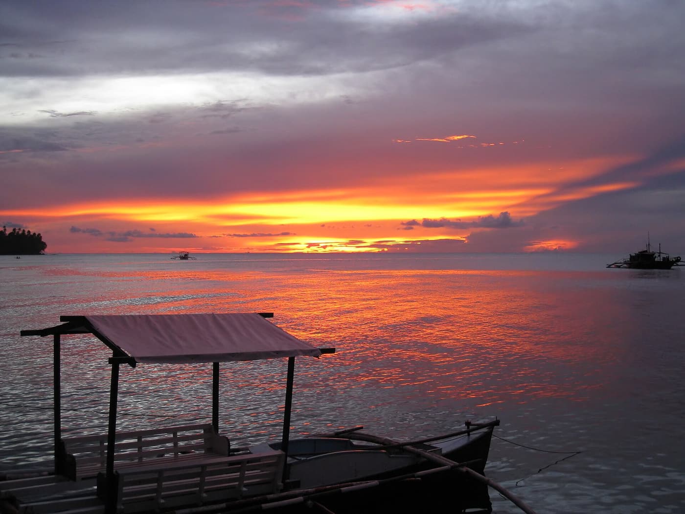 An orange sunset over the sea from Camiguin’s coast